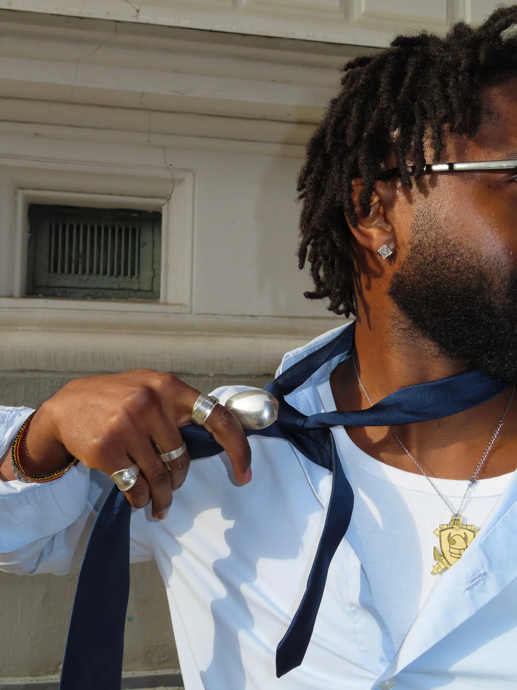 Rawform rings worn with a tailored blue shirt